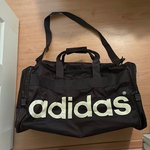Adidas chocolate brown duffle bag.